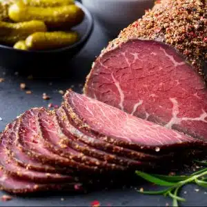 roasted beef pastrami on slate cutting board clo e1668073024475